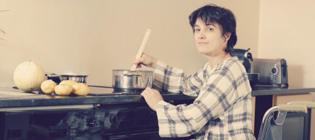 Person with a disability in an accessible kitchen